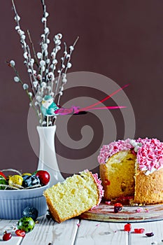 Sweet and appetizing cupcake with pink sprinkling on the table