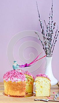 Sweet and appetizing cupcake with pink sprinkling on the table