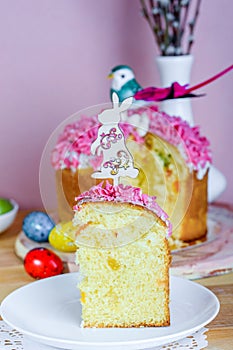 Sweet and appetizing cupcake with pink sprinkling on the table