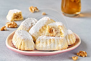Sweet arabic pastries stuffed with walnuts . Traditional maamoul cookies