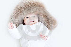 Sweet baby in a big fur hat