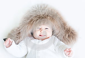 Sweet baby in a big fur hat