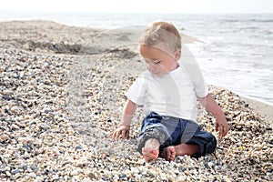 Sweet baby boy on the beach