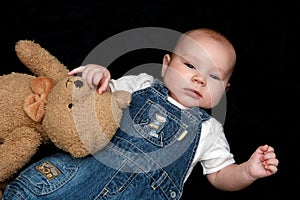 Sweet baby boy with cuddly toy