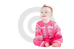 Sweet baby girl in a pink sweater with hearts pattern