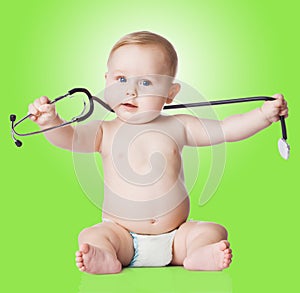 Sweet baby with stethoscope on a green background.