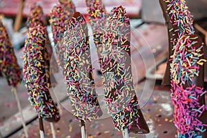 Sweet bananas in chocolates on a stick sold on the streets of Hiroshima in Japan