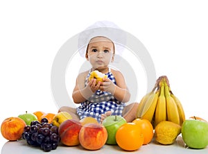 Sweet beautiful baby cook eating healthy fruits