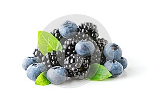 Sweet berries mix with green leaves isolated on white background. Ripe blueberry and blackberry