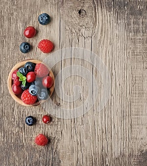 Sweet berry mix on wooden backgrounds