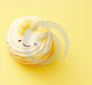 sweet biscuit with kawaii smiling face on yellow background