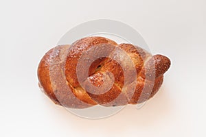 Sweet braided roll bun isolated over white background