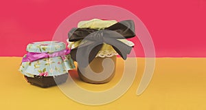 Sweet Brazilian milk and jelly in on pot  on colored background. Fresh colors pastel trend photo