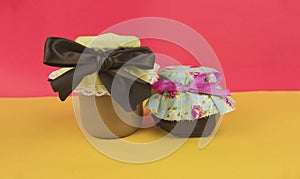 Sweet Brazilian milk and jelly in on pot isolated on colored background. Fresh colors pastel trend photo