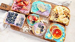 Sweet breakfast. Colorful toasts with fruits and berries. Children\'s food concept