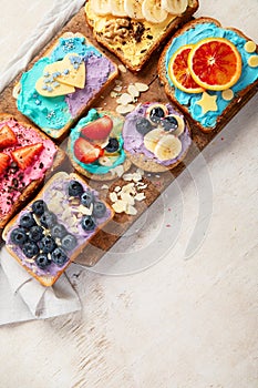 Sweet breakfast. Colorful toasts with fruits and berries. Children\'s food concept