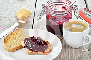 Sweet breakfast toasted bread and plum jam photo