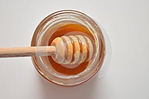 Sweet brown honey on white background