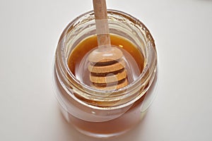 Sweet brown honey on white background