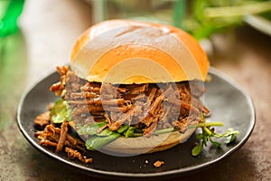 Sweet bun barbecue beef brisket bun with watercress leaves