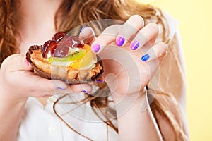 Sweet cake cupcake on woman hand