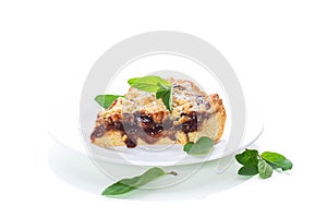 Sweet cake with fruit jam in a plate on a white