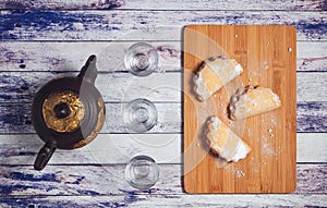 Cookies on a tray with a tea kettle photo