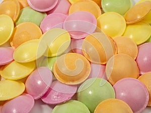 Sweet candies in the shape of a UFO in different colors.