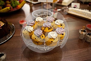 Sweet candy bar.Different delicious fruits and cakes on wedding reception table . photo