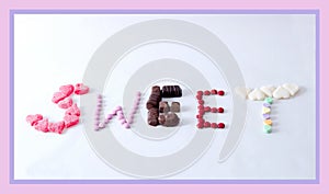 Variety of  candy spelling out the word sweet