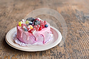 Sweet cheese cake with fresh berries and yoghurt cream. Delicious raspberry cake with fresh strawberries, raspberries