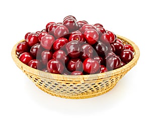 Sweet cherry berries (Prunus avium) in wicker plate