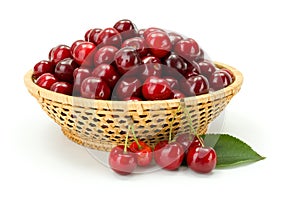 Sweet cherry berries (Prunus avium) in wicker plate