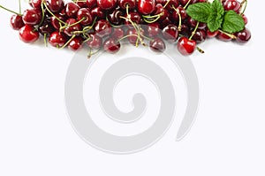 Sweet cherry berries on white background cutout. Cherry fruit at border of image with copy space for text.