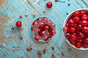 Sweet Cherry in Bowl on Rustic Table photo