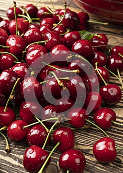 Sweet cherry in water drops a bunch of juicy and ripe cherries