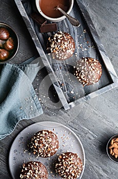 Sweet chestnut cups filled with soft curd cheese, chestnut puree and ground almonds, topped with chocolate frosting and chopped nu