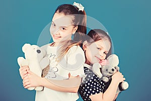 Sweet childhood. Childhood concept. Kids adorable cute girls play with soft toys. Happy childhood. Child care