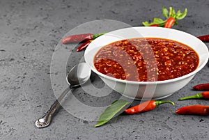 Sweet chili sauce in bowl with copy space