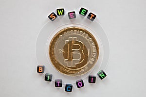 Sweet chocolate bitcoin on white background