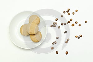 Sweet chocolate,lemon macarons on plate, coffee beans isolated on white background, pastry, confectionery desserts