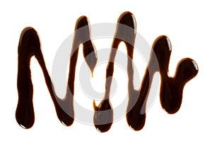 Sweet chocolate sauce isolated on white background. Chocolate syrup drop