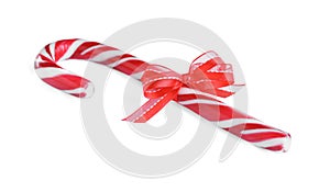 Sweet Christmas candy cane with red bow isolated on white