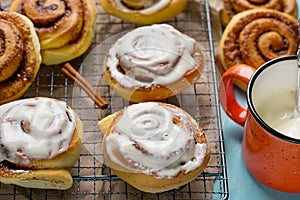 Sweet cinnamon roll bun with cream cheese glaze