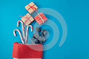Sweet coal and candy with gift box in sock. Typical things for Epiphany day or Dia da Reyes Magos