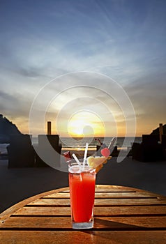 Sweet cocktail on sunset beach photo