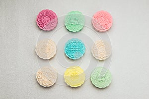 Sweet color of snow skin mooncake on plate. Chinese mid autumn f