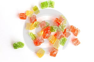 Sweet colorful candied fruit on a white background