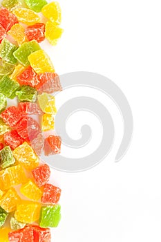 Sweet colorful candied fruit on a white background