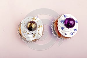 Sweet, colorful cupcakes decorated with sugar paste and cream. Concept of art paty. Flat lay, top veiw photo